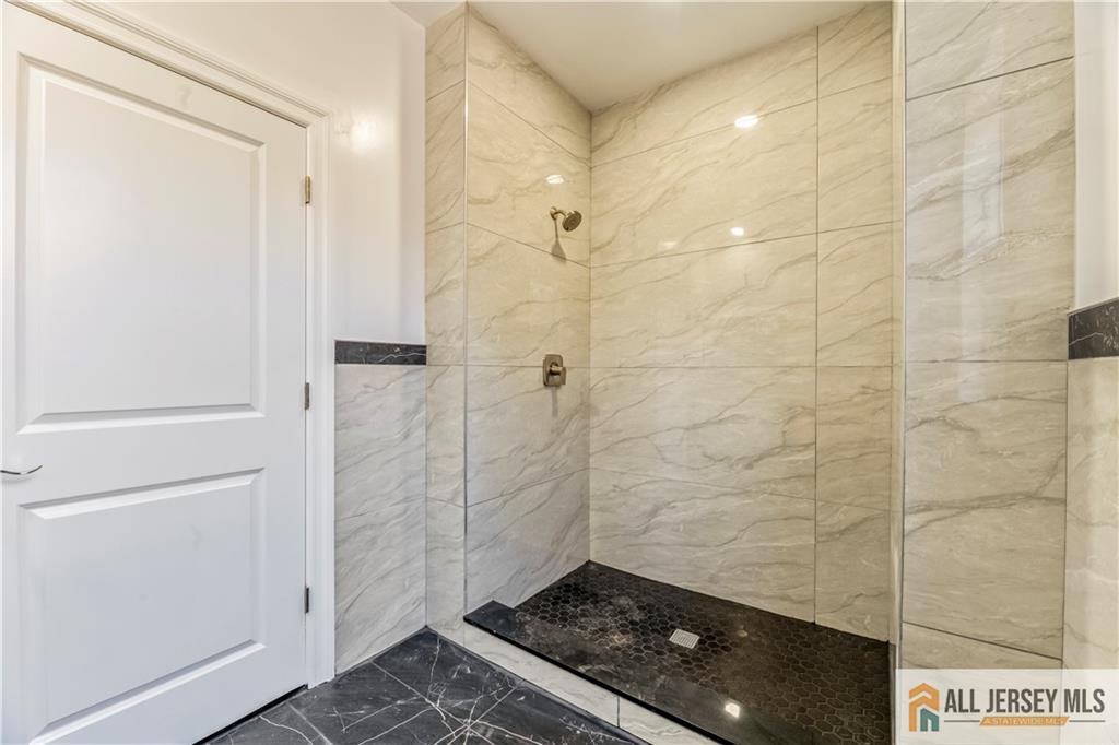 28 King George Road Warren, NJ 07059 - Photo 40 of 63 a bathroom with a shower