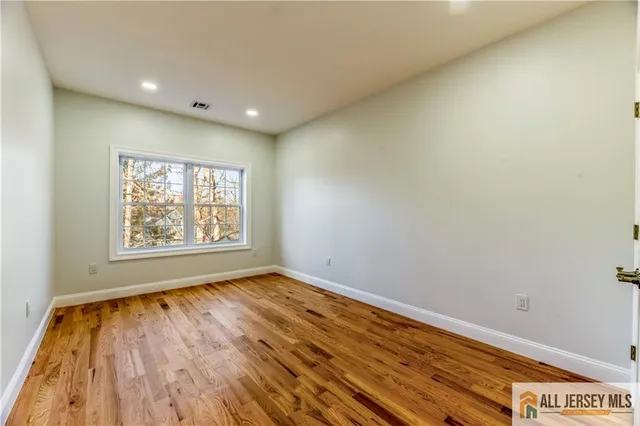 a view of a balcony with wooden floor