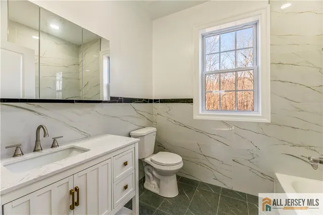 a view of a balcony with wooden floor and fence