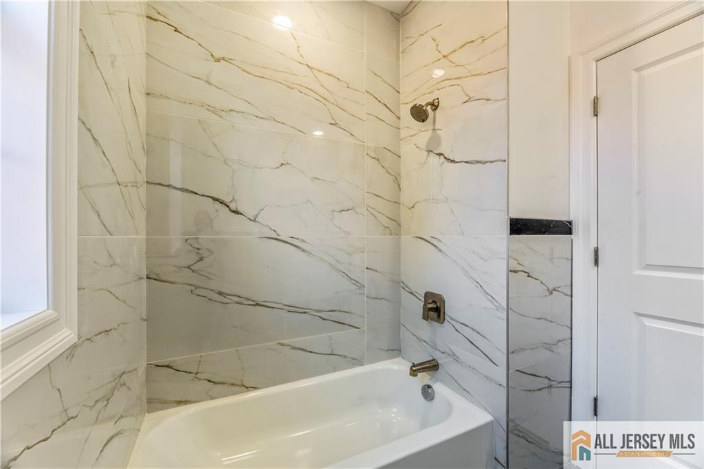 28 King George Road Warren, NJ 07059 - Photo 45 of 63 a bathroom with a bathtub