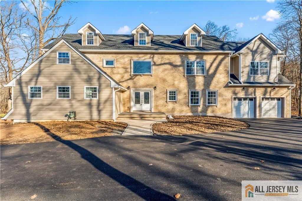28 King George Road Warren, NJ 07059 - Photo 5 of 63 a view of a white house with large windows