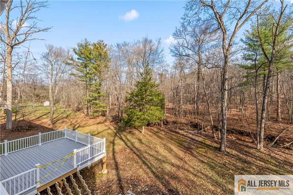 28 King George Road Warren, NJ 07059 - Photo 52 of 63 a view of a balcony with wooden floor and fence