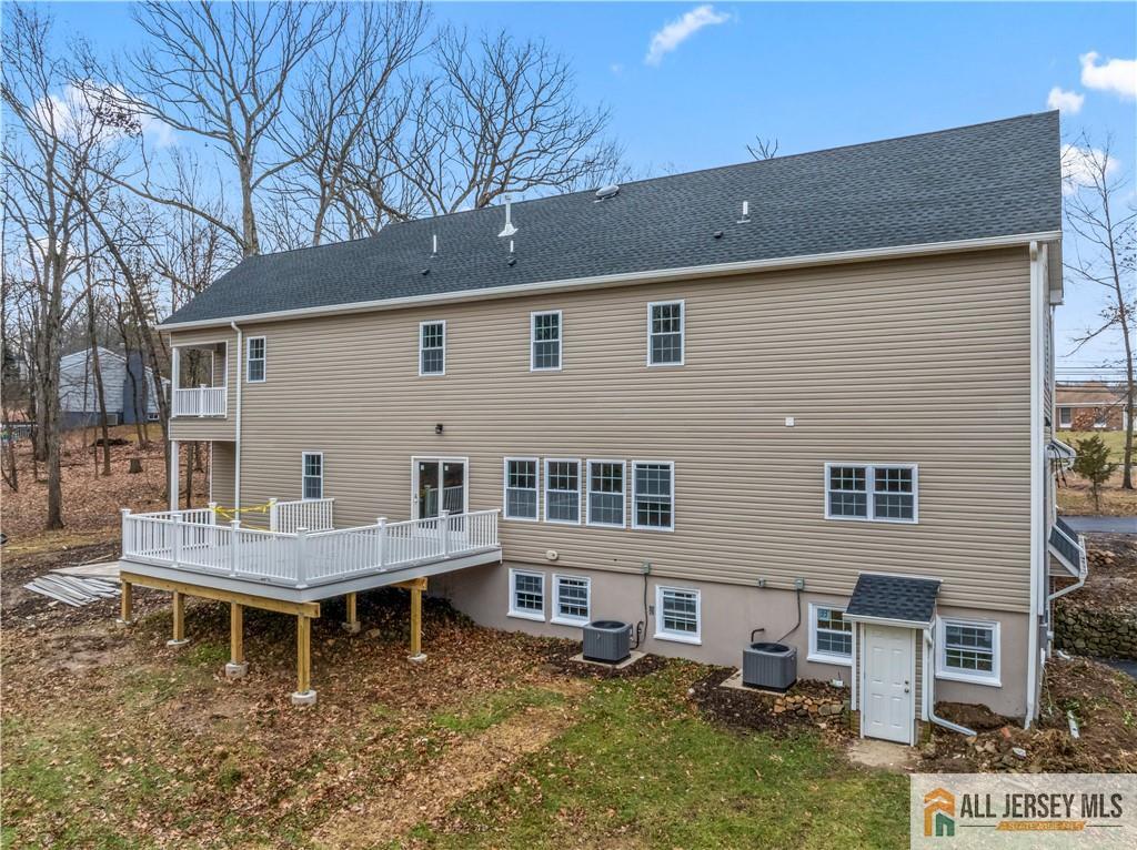 28 King George Road Warren, NJ 07059 - Photo 53 of 63 a backyard of a house with wooden deck and outdoor seating