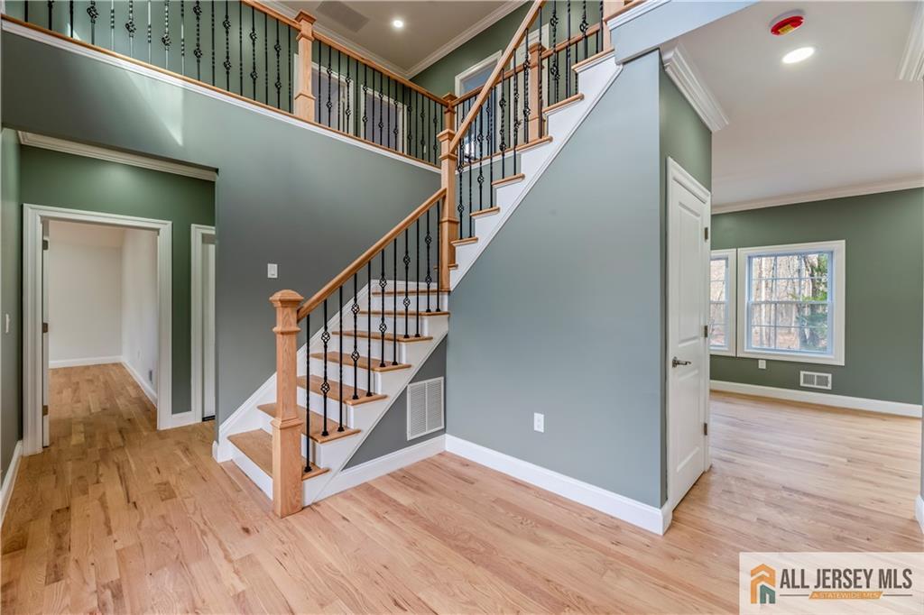 28 King George Road Warren, NJ 07059 - Photo 9 of 63 a view of an entryway wooden floor and windows