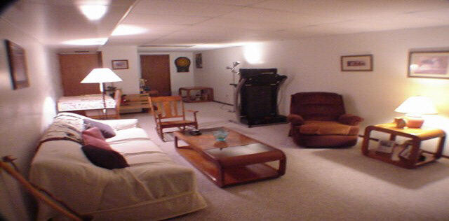 1032 South Trainer Road Rockford, IL 61108 - Photo 5 of 6 a living room with furniture and a lamp