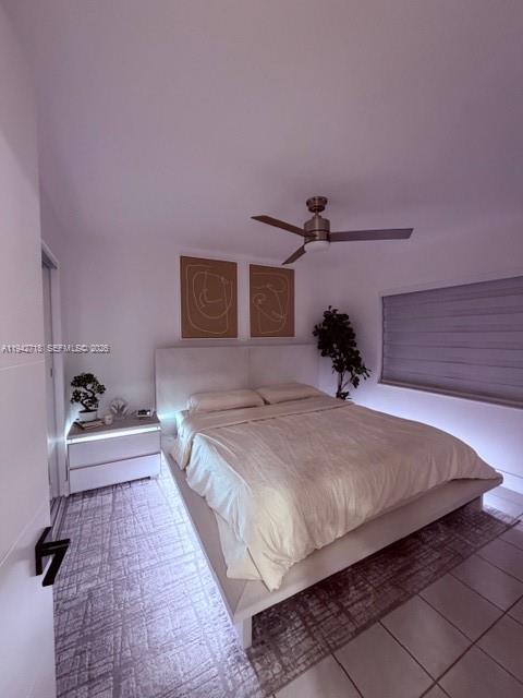 12840 Southwest 43rd Drive, Unit 274B Miami, FL 33175 - Photo 12 of 15 a bedroom with a bed and a potted plant on table