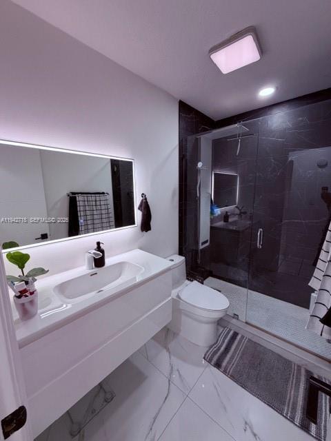 12840 Southwest 43rd Drive, Unit 274B Miami, FL 33175 - Photo 15 of 15 a bathroom with a sink a toilet and mirror