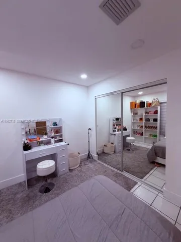 a room with furniture and a flat screen tv