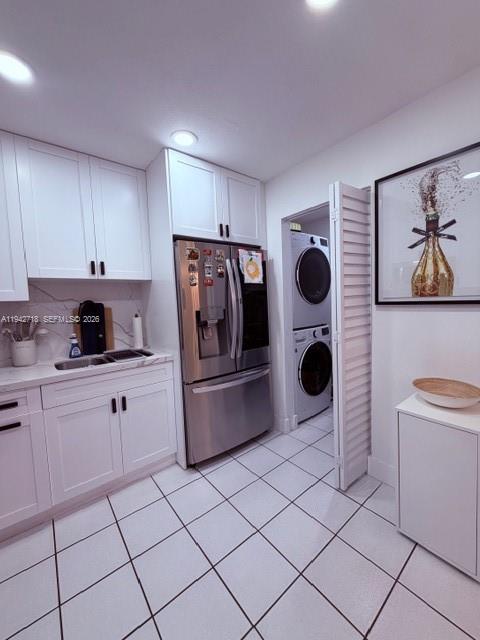 12840 Southwest 43rd Drive, Unit 274B Miami, FL 33175 - Photo 8 of 15 a kitchen with stainless steel appliances a stove a sink and cabinets