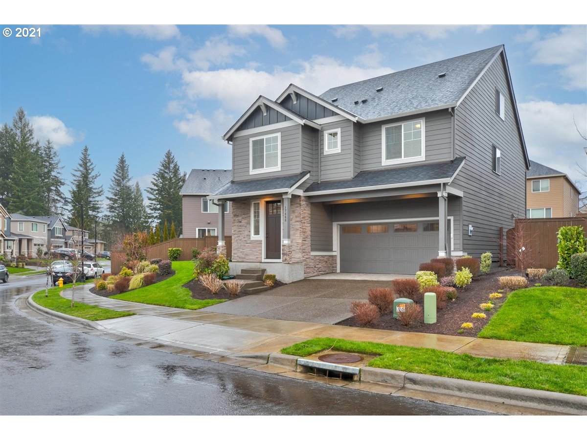 a front view of a house with garden