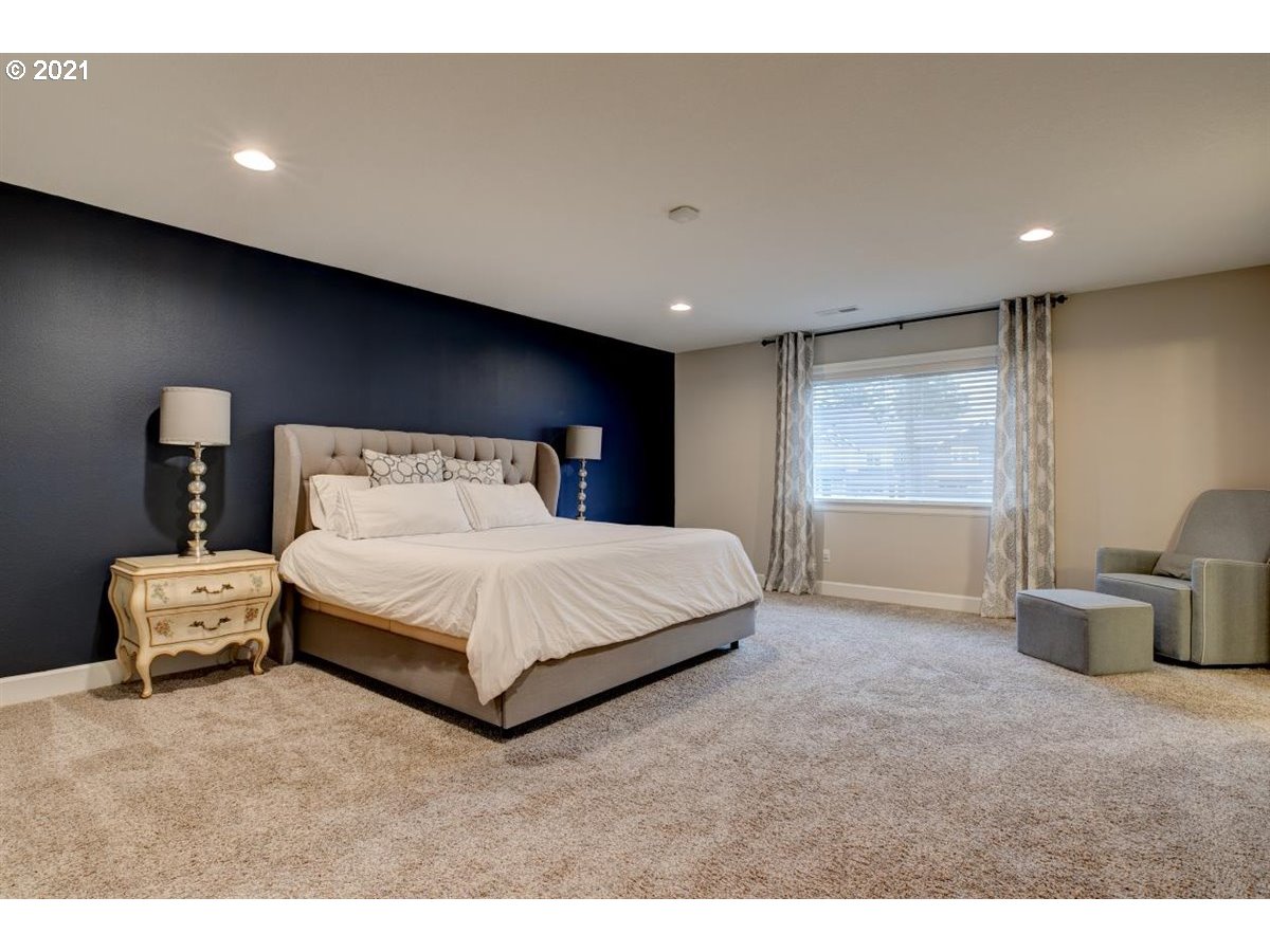 17468 Northwest Woodrush Way Portland, OR 97229 - Photo 13 of 32 a bedroom with a bed and window