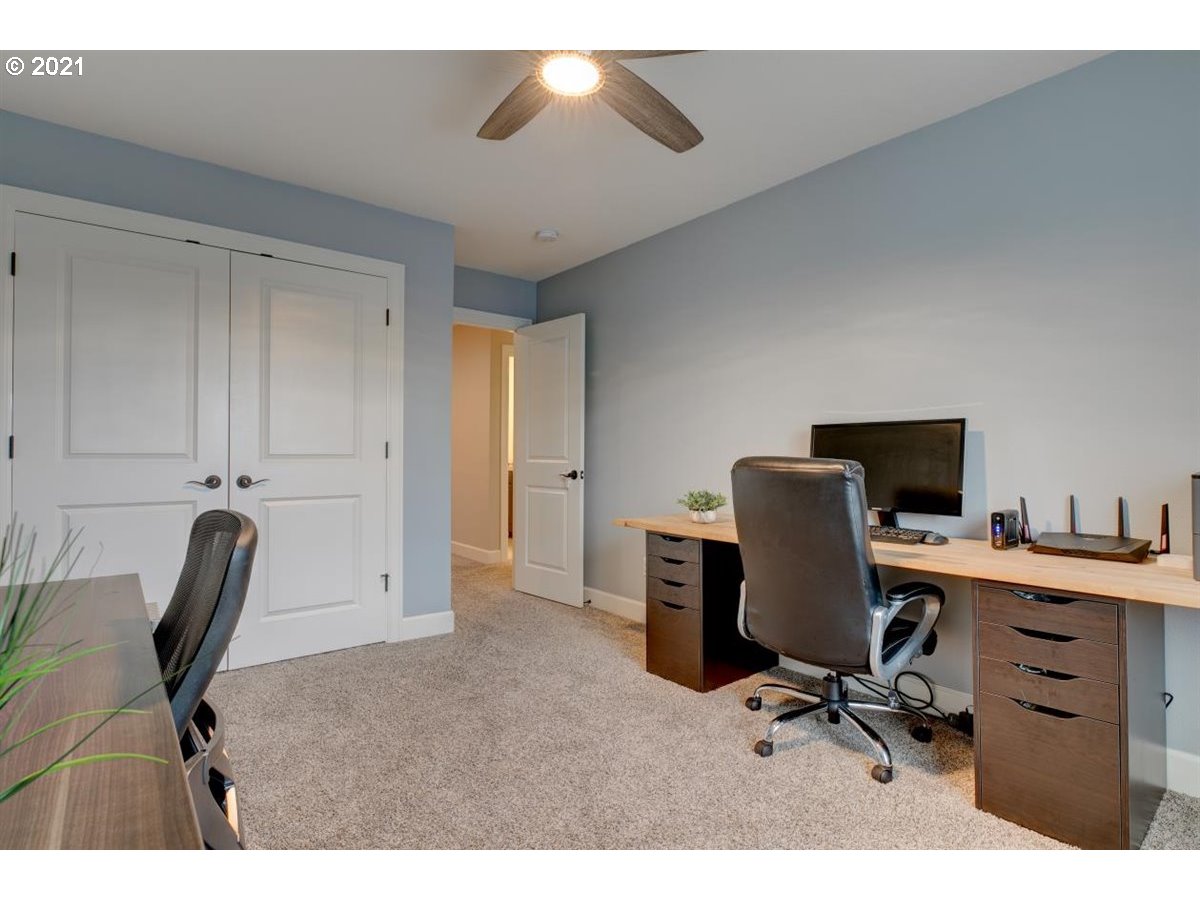 17468 Northwest Woodrush Way Portland, OR 97229 - Photo 23 of 32 a view of a workspace with furniture and a chair