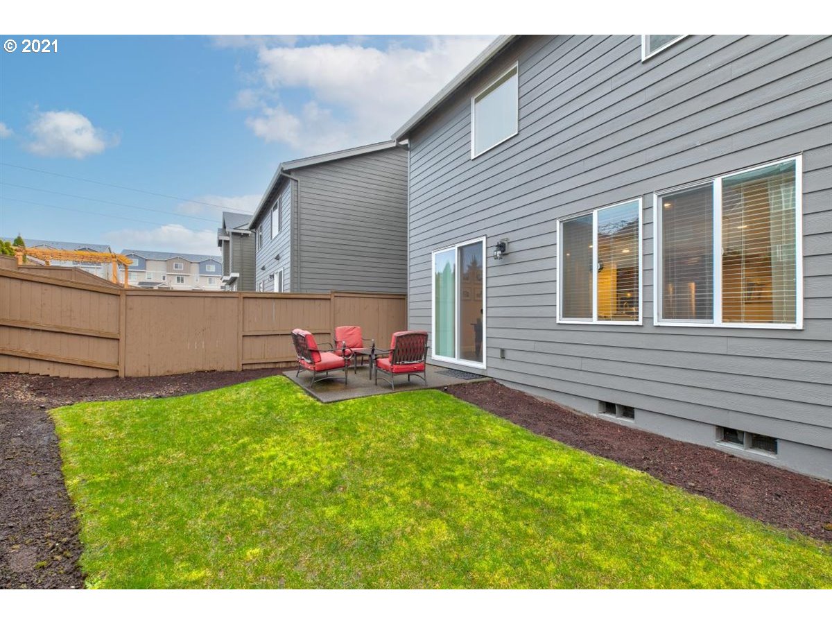 17468 Northwest Woodrush Way Portland, OR 97229 - Photo 27 of 32 a view of a backyard with sitting area