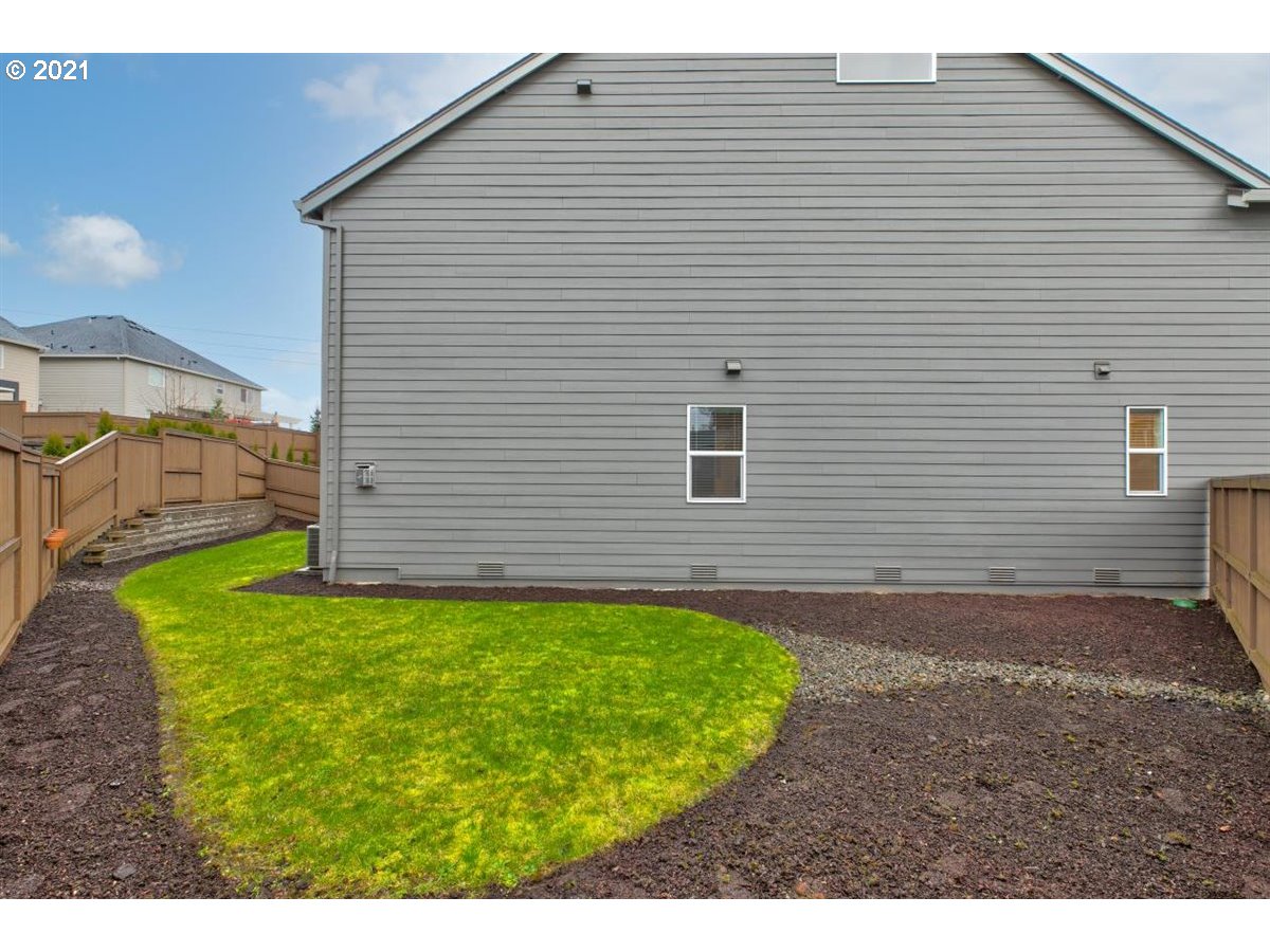 17468 Northwest Woodrush Way Portland, OR 97229 - Photo 28 of 32 a view of a backyard with potted plants