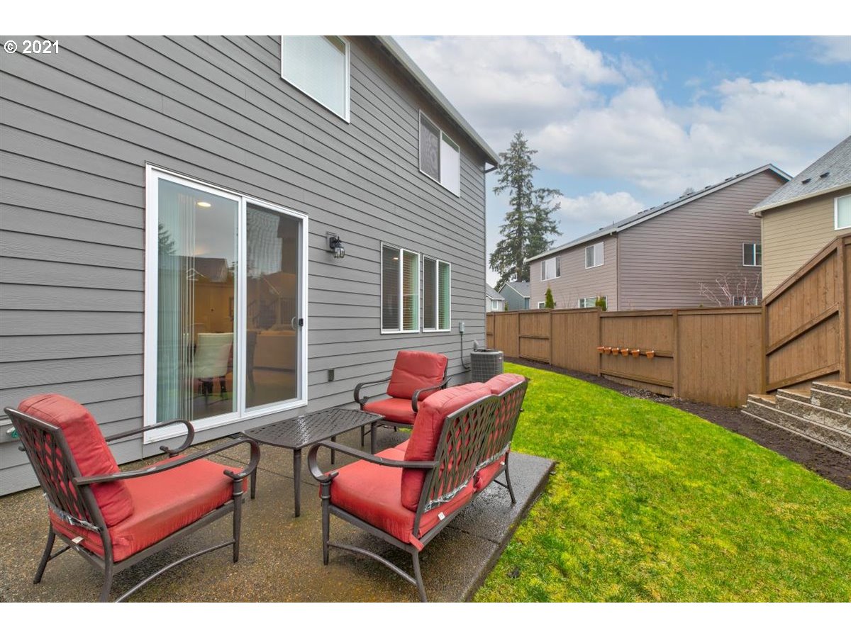 17468 Northwest Woodrush Way Portland, OR 97229 - Photo 29 of 32 a backyard of a house with seating space