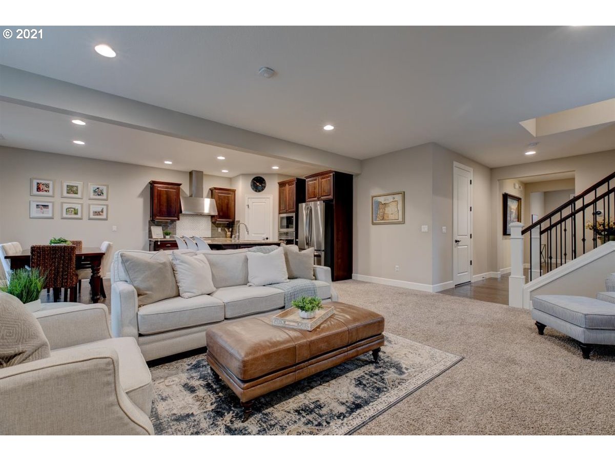 17468 Northwest Woodrush Way Portland, OR 97229 - Photo 7 of 32 a living room with furniture and a wooden floor