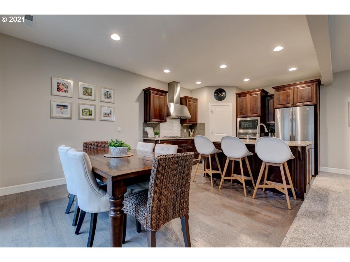 17468 Northwest Woodrush Way Portland, OR 97229 - Photo 8 of 32 a view of a dining room with furniture