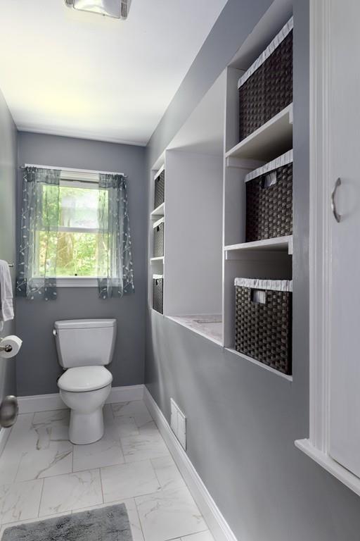 9 Highgate Road Wayland, MA 01778 - Photo 12 of 21 a bathroom with a toilet a sink and window