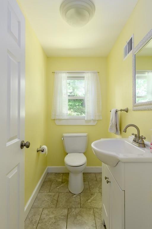 9 Highgate Road Wayland, MA 01778 - Photo 9 of 21 a bathroom with a sink toilet and a mirror