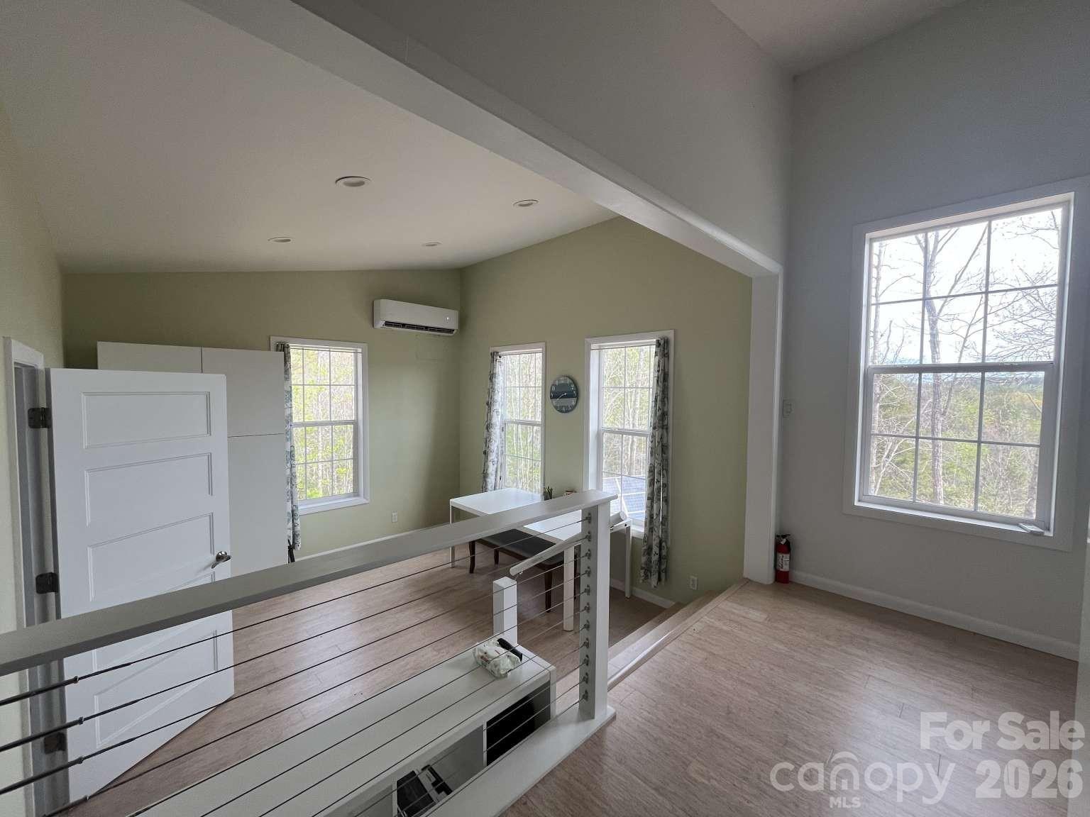 3445 Irish Hills Road Morganton, NC 28655 - Photo 19 of 34 a workspace with furniture window and wooden floor