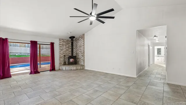 wooden floor and an empty room with a ceiling fan