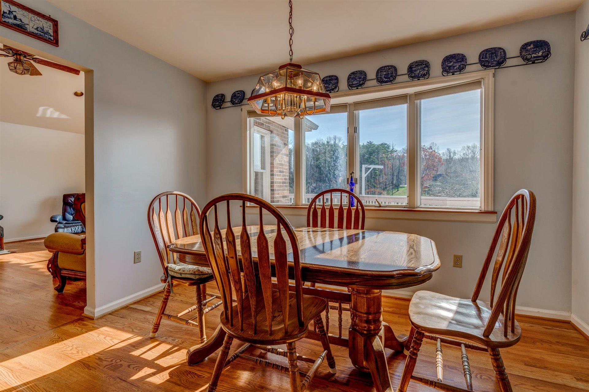 171 Sandy Point Court Union Hall, VA 24176 - Photo 12 of 65 a view of a dining room with furniture window and outside view