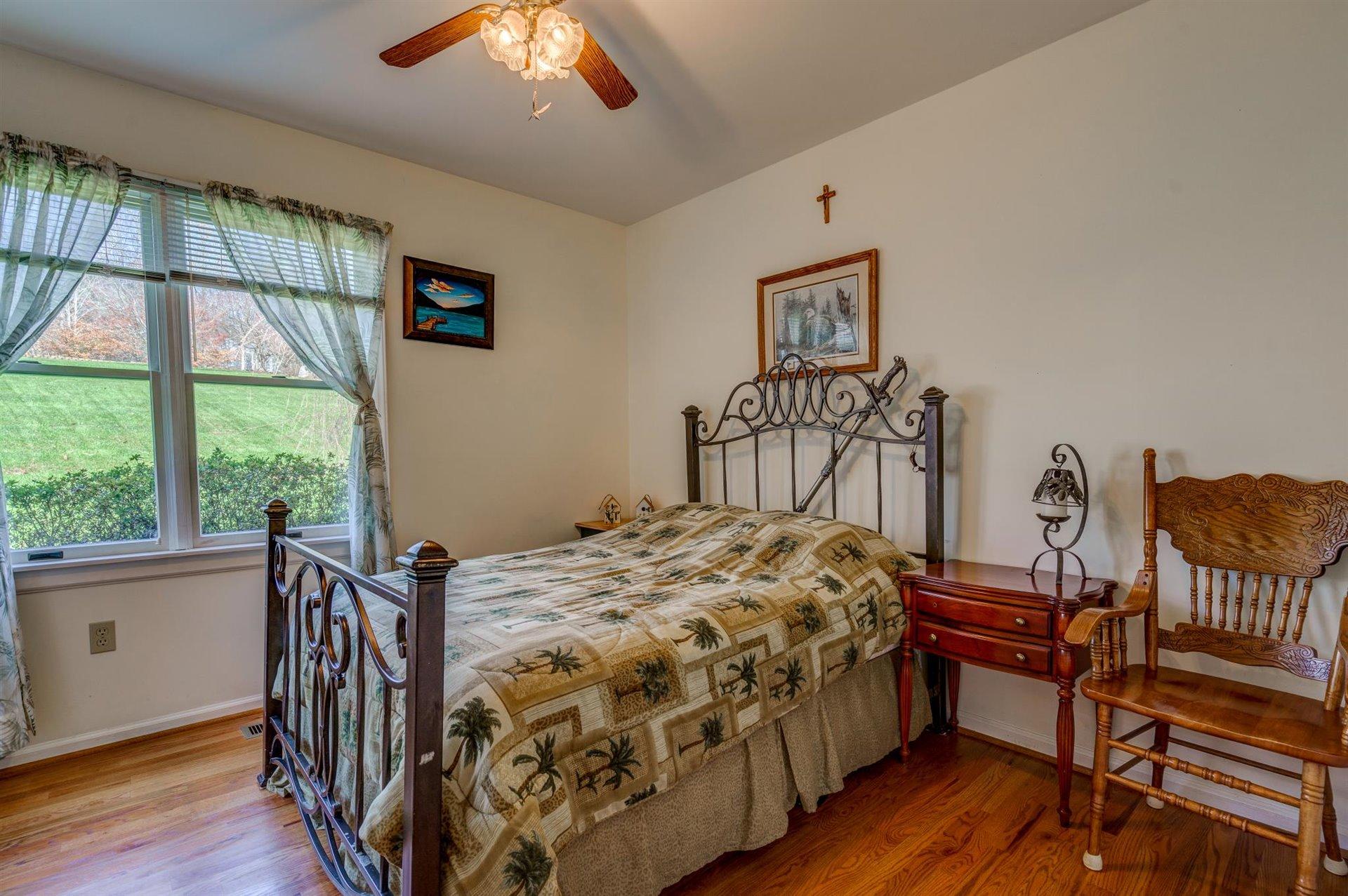 171 Sandy Point Court Union Hall, VA 24176 - Photo 25 of 65 a bedroom with a bed and a window