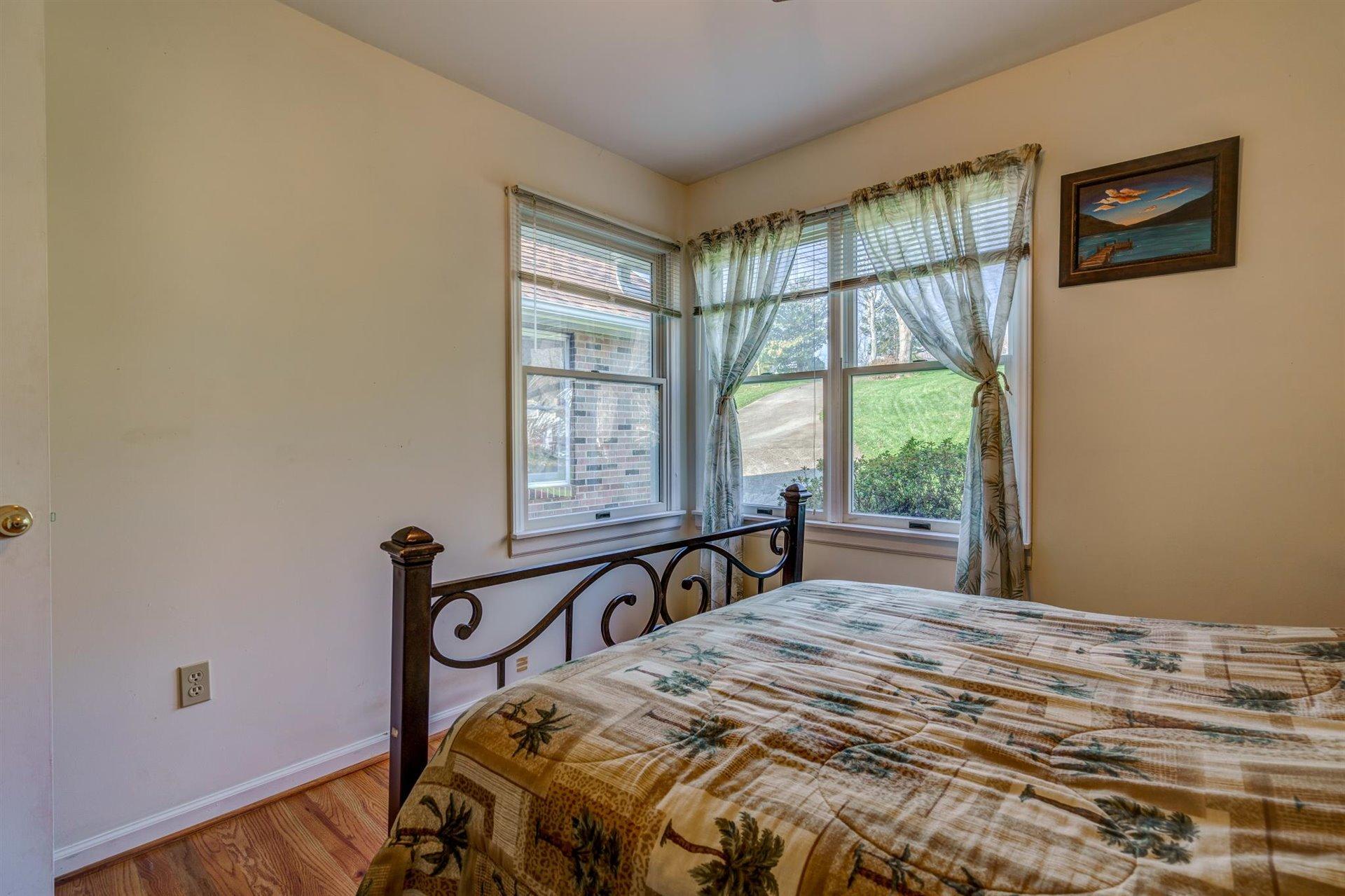 171 Sandy Point Court Union Hall, VA 24176 - Photo 26 of 65 a bedroom with a bed and a window