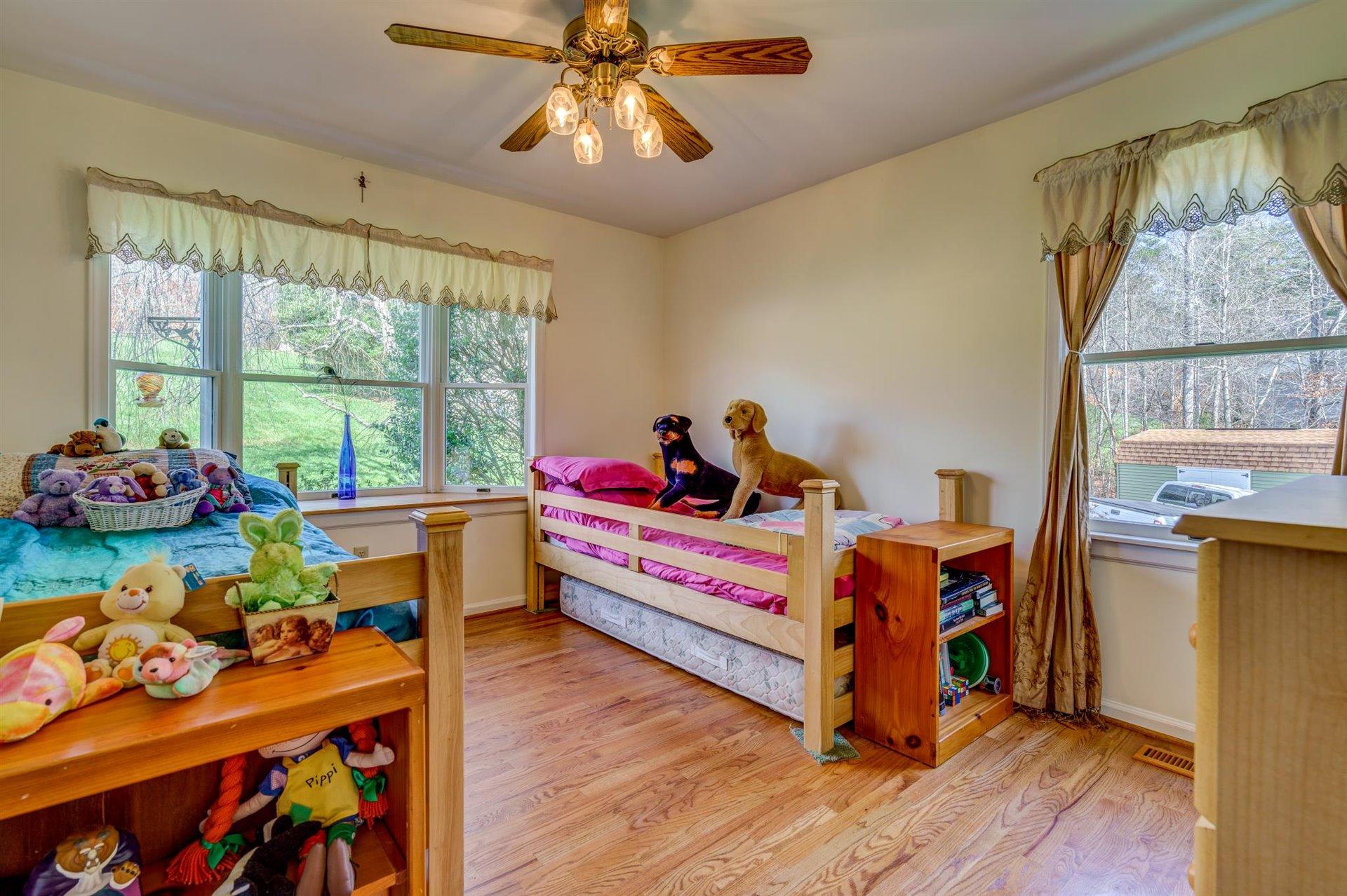 171 Sandy Point Court Union Hall, VA 24176 - Photo 27 of 65 a bed room with furniture and a window
