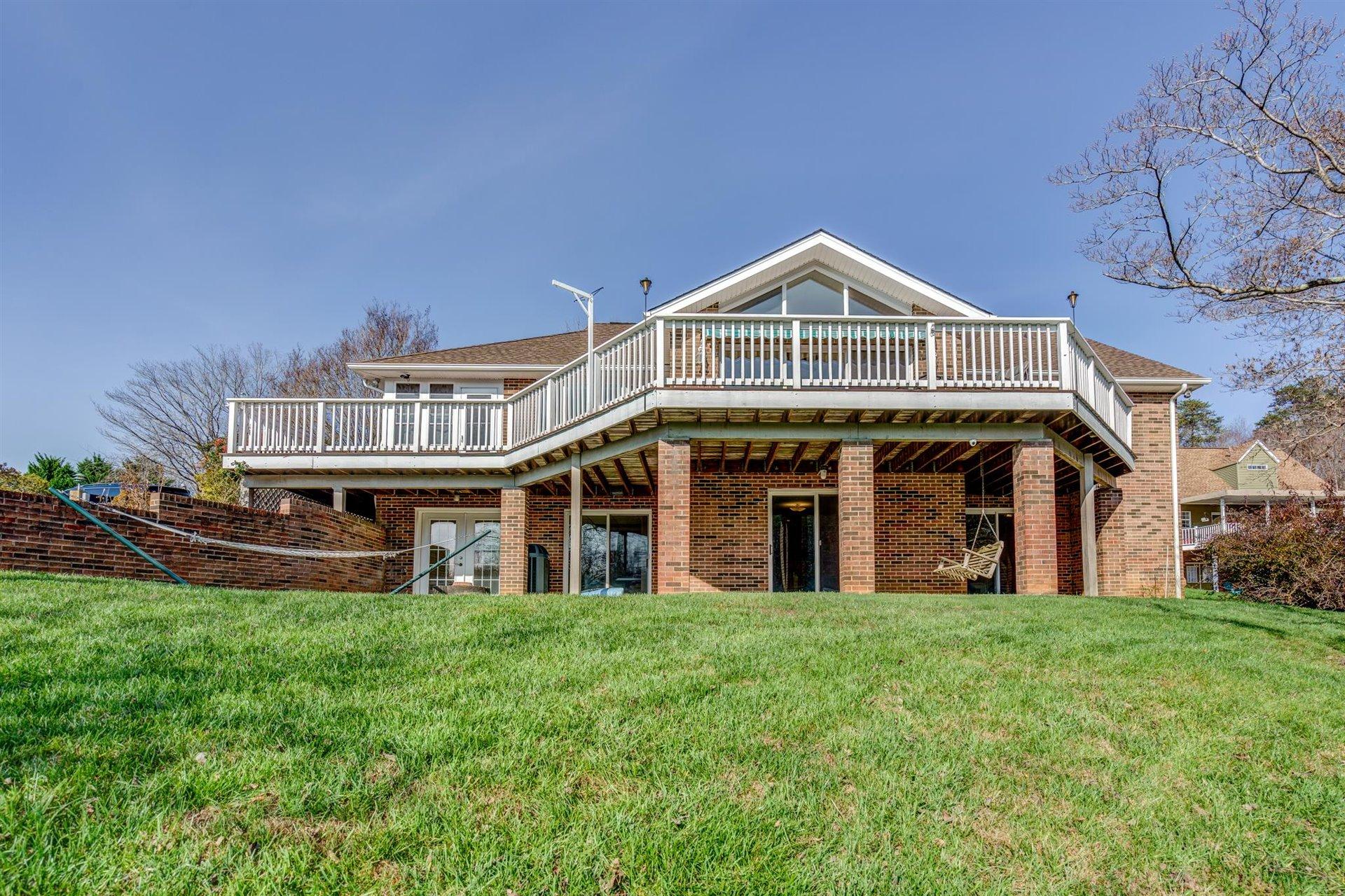 171 Sandy Point Court Union Hall, VA 24176 - Photo 5 of 65 a front view of a house with a garden