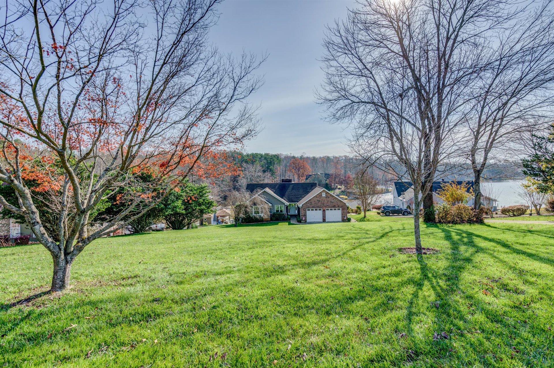 171 Sandy Point Court Union Hall, VA 24176 - Photo 57 of 65 a view of a big yard with plants and trees