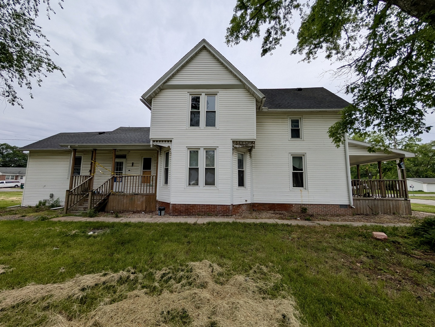 440 North Campbell Street Macomb, IL 61455 - Photo 5 of 50 a view of a white house with a yard and sitting area