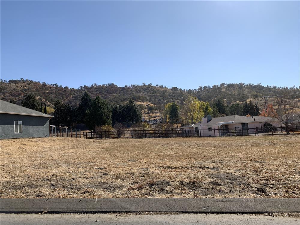 Buckpasser Drive Tehachapi, CA 93561 - Photo 16 of 17 a backyard of a house with large trees