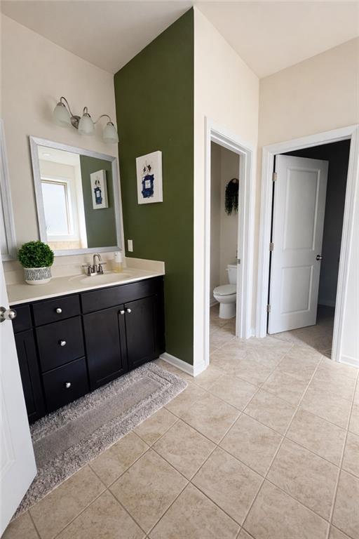 208 Sebastian Cove Hampton, GA 30228 - Photo 11 of 15 a spacious bathroom with a granite countertop sink and a mirror