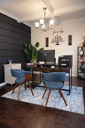 a living room with furniture and a piano