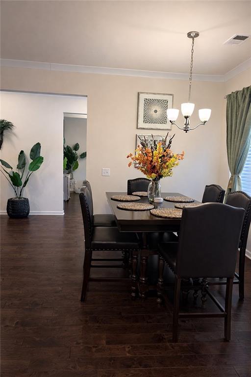 208 Sebastian Cove Hampton, GA 30228 - Photo 4 of 15 a view of a dining room with furniture and wooden floor