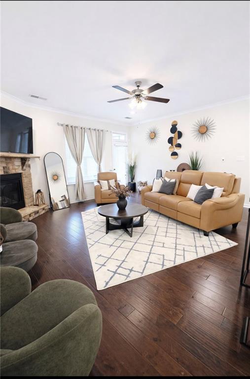 208 Sebastian Cove Hampton, GA 30228 - Photo 7 of 15 a living room with furniture and a flat screen tv