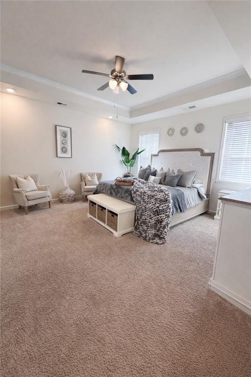 208 Sebastian Cove Hampton, GA 30228 - Photo 9 of 15 a living room with furniture and a chandelier