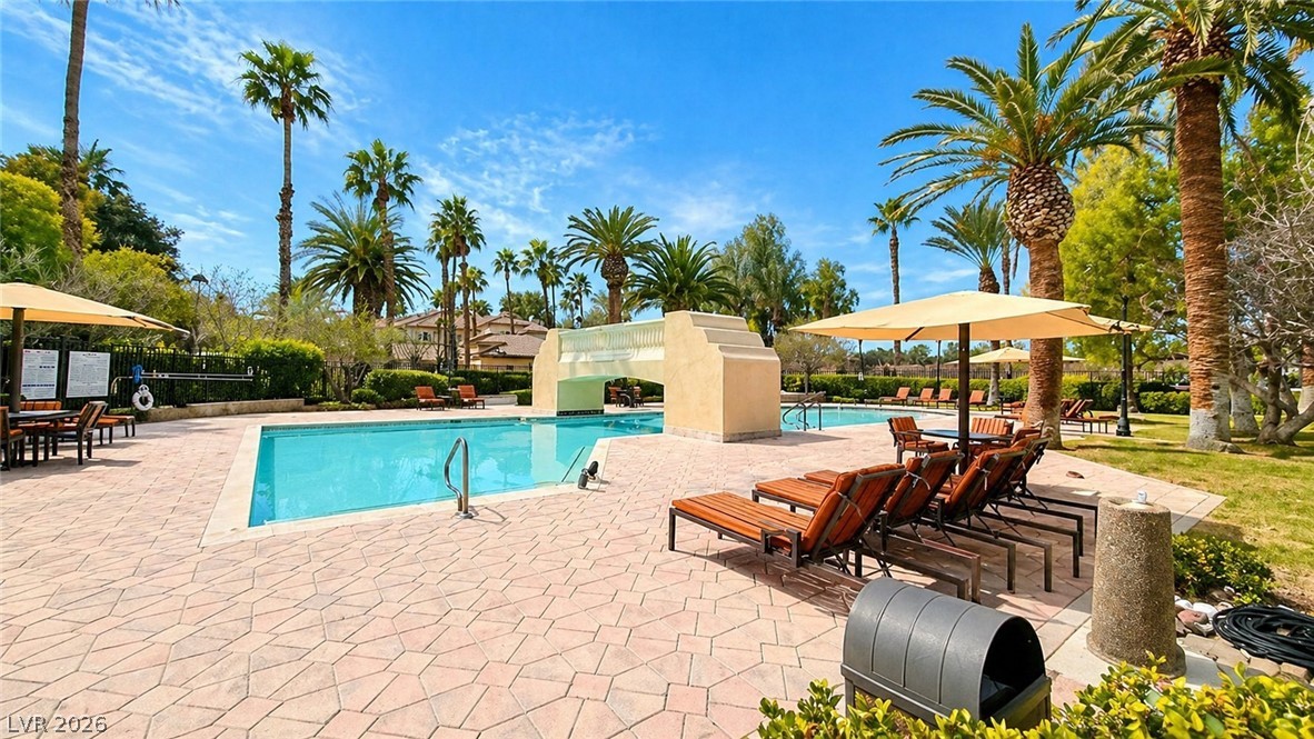 2050 West Warm Springs Road, Unit 2422 Henderson, NV 89014 - Photo 43 of 44 This inviting community pool area features ample lounge seating, perfect for relaxation under the sun.