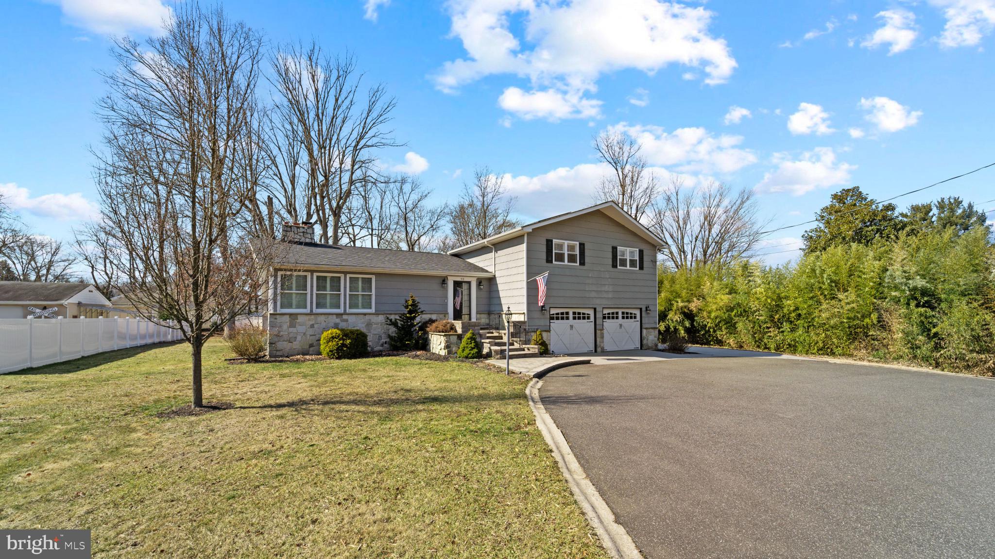 93 Harmony Road Mickleton, NJ 08056 - Photo 2 of 34 a front view of a building with garden