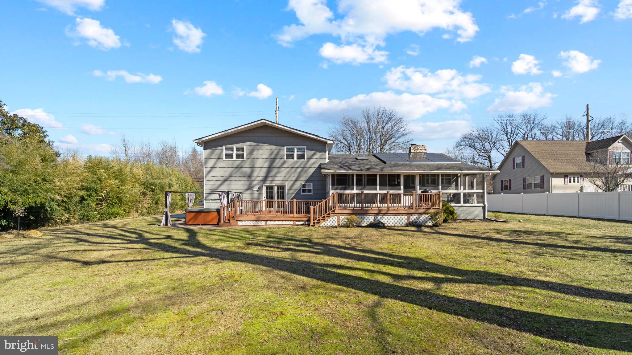 93 Harmony Road Mickleton, NJ 08056 - Photo 24 of 34 a view of a house with a big yard and large trees