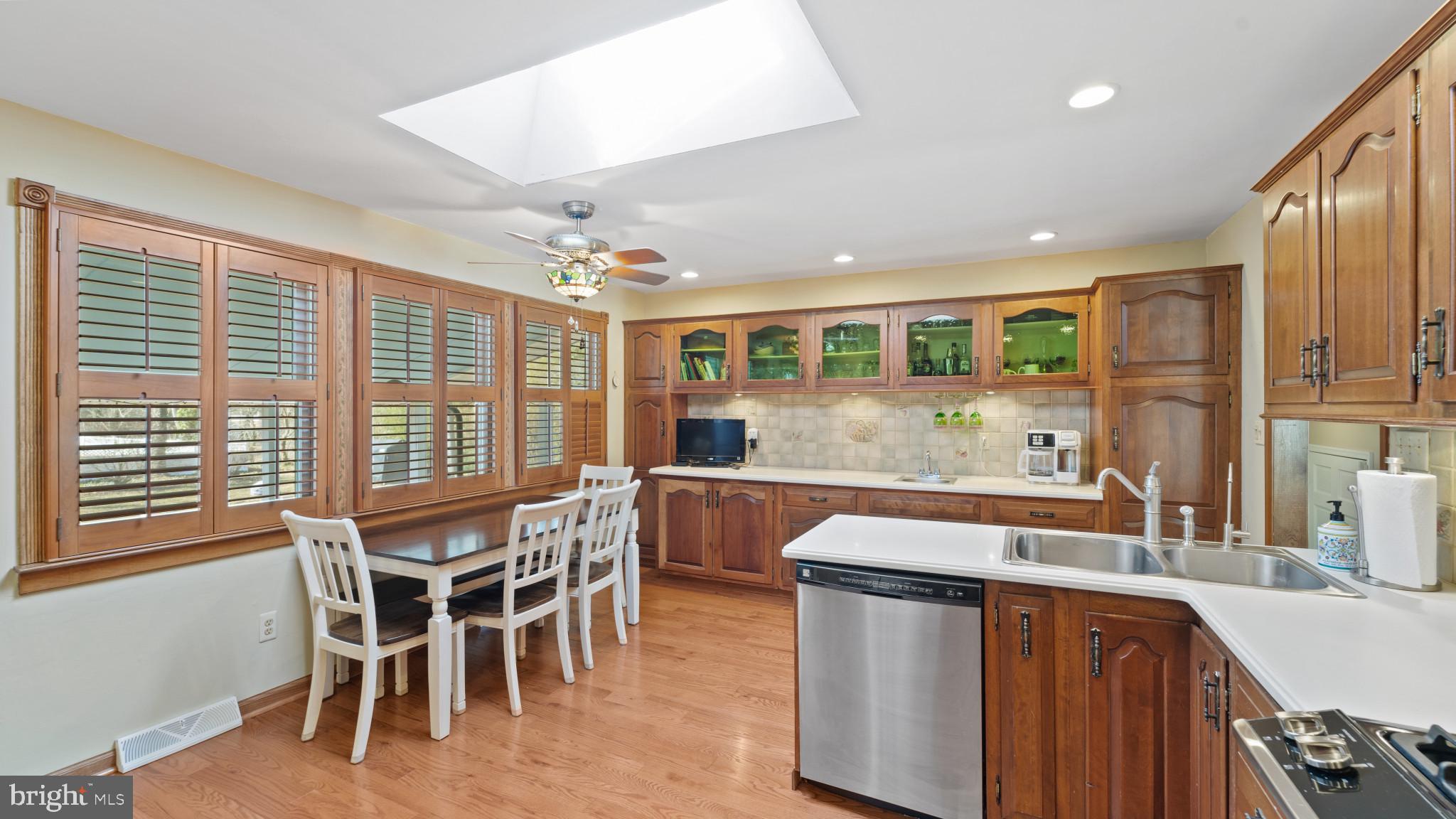 93 Harmony Road Mickleton, NJ 08056 - Photo 9 of 34 a kitchen with a table chairs sink and cabinets