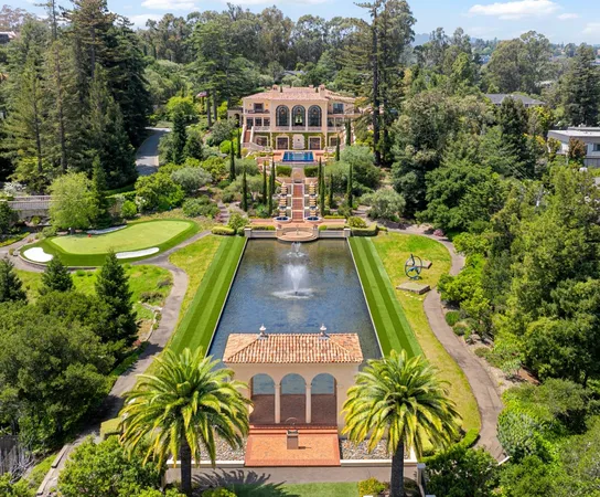 an aerial view of a house with a swimming pool
