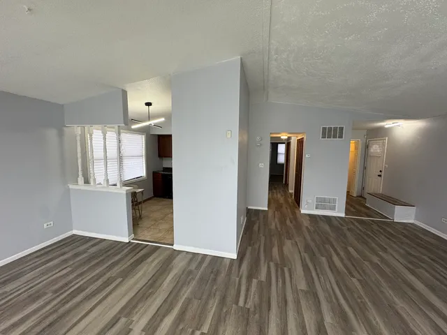 a kitchen with stainless steel appliances granite countertop a stove sink and cabinets