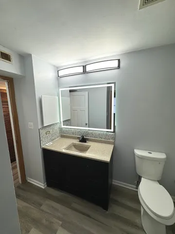 an empty room with windows and wall