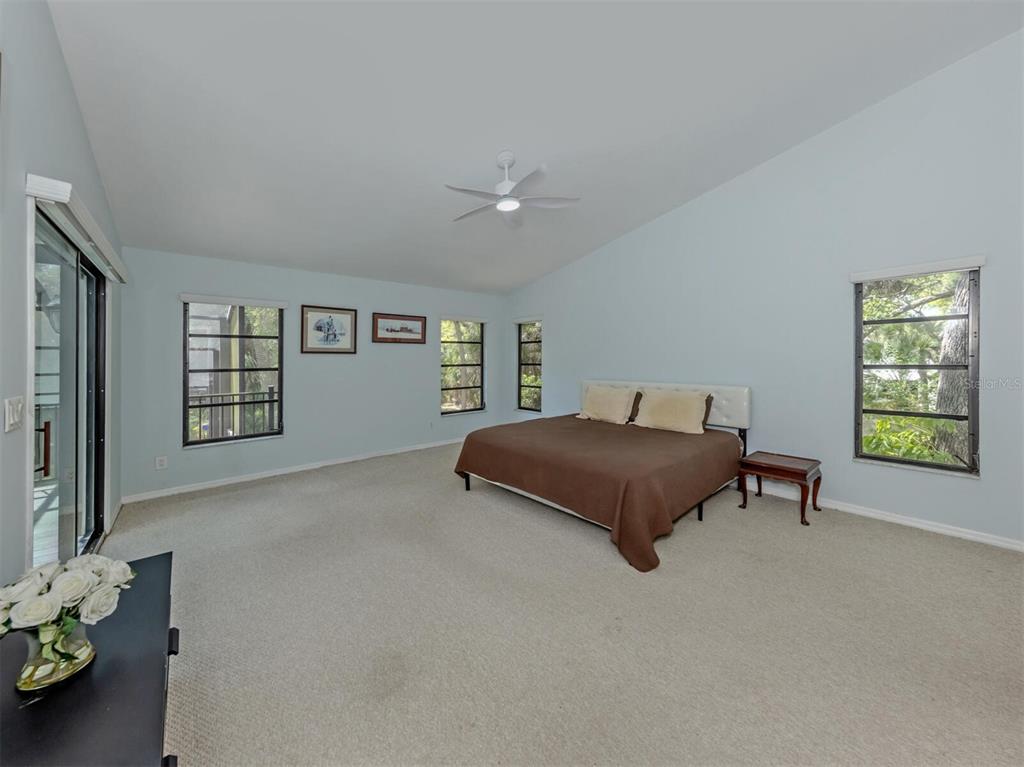 2602 Firetree Lane Venice, FL 34292 - Photo 20 of 31 a bedroom with a bed and a window