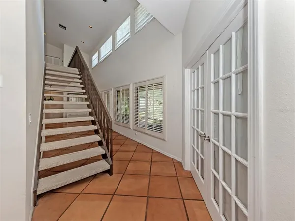 a view of entryway with stairs and wooden floor