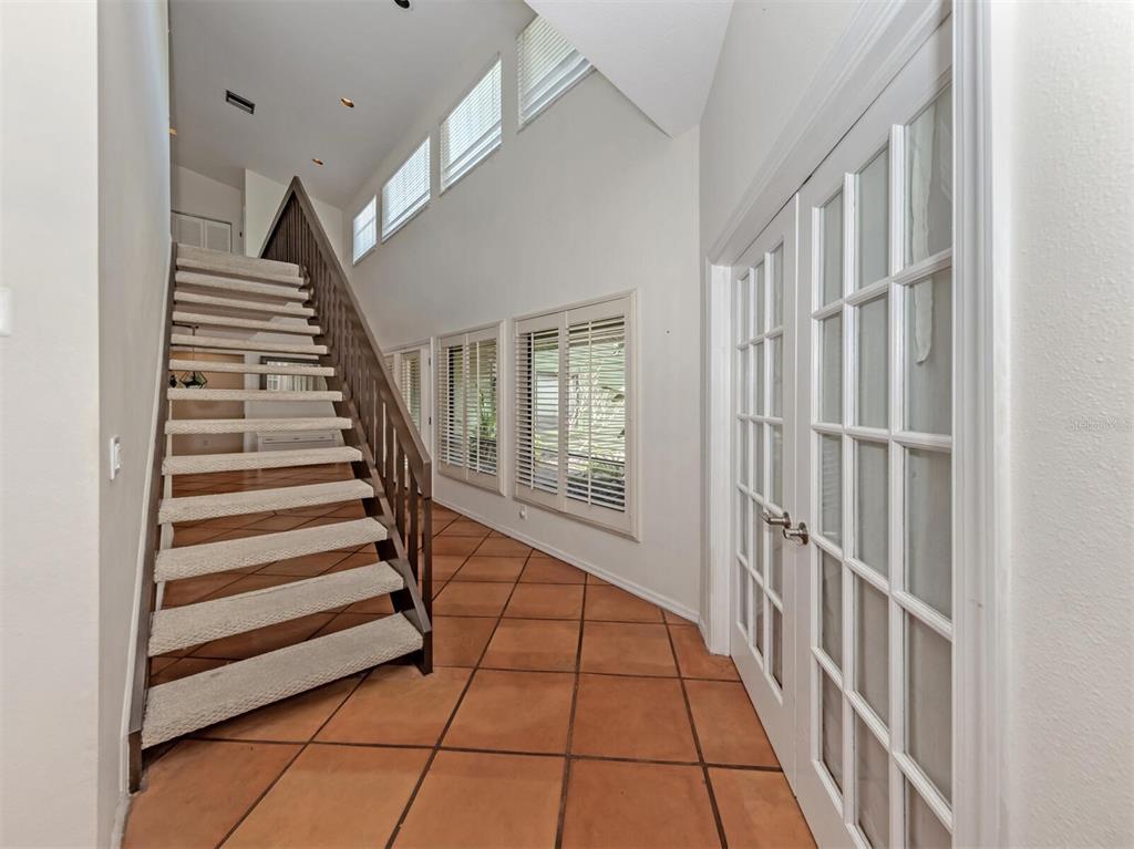 2602 Firetree Lane Venice, FL 34292 - Photo 2 of 31 a view of entryway with stairs and wooden floor