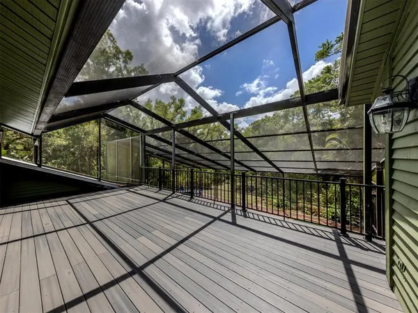 a view of balcony with wooden floor