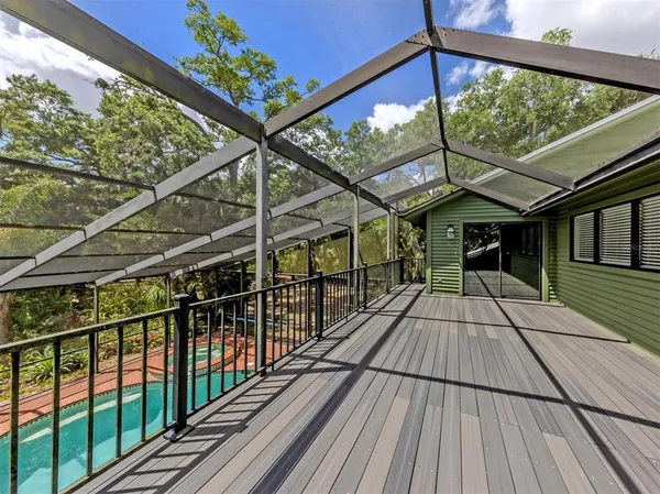 a view of outdoor space with wooden floor